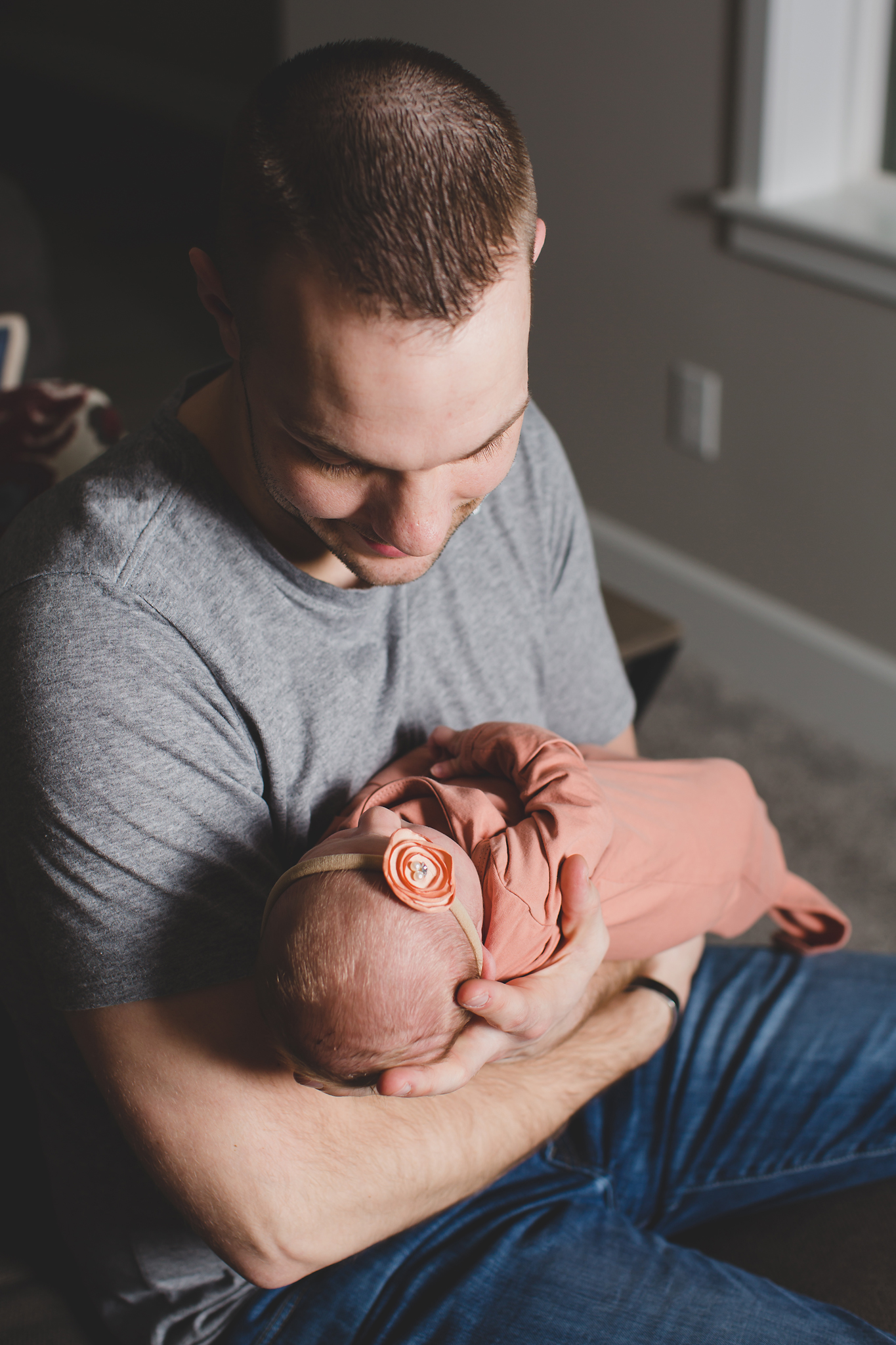 Baby Myla lifestyle newborn session at home snuggling with her dad